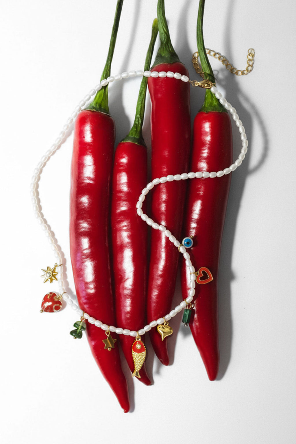 Kralen ketting met bedeltjes