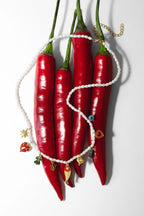 Kralen ketting met bedeltjes